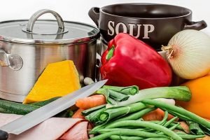 Fresh vegetables and soup ingredients representing nutritious eating.