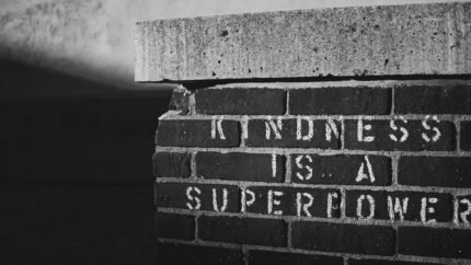 Kindness is a Super Power written on a brick wall