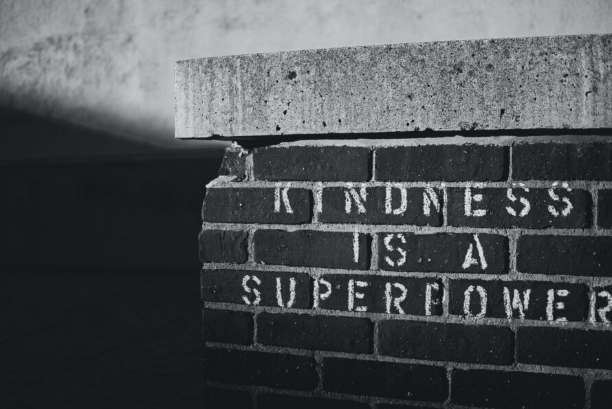 Kindness is a Super Power written on a brick wall