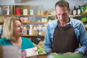 Shoppers choosing groceries while preparing for Thanksgiving dinner